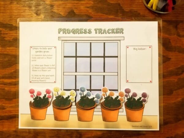 Chore chart progress tracker with flower pots