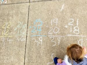 Math problems with chalk outside.
