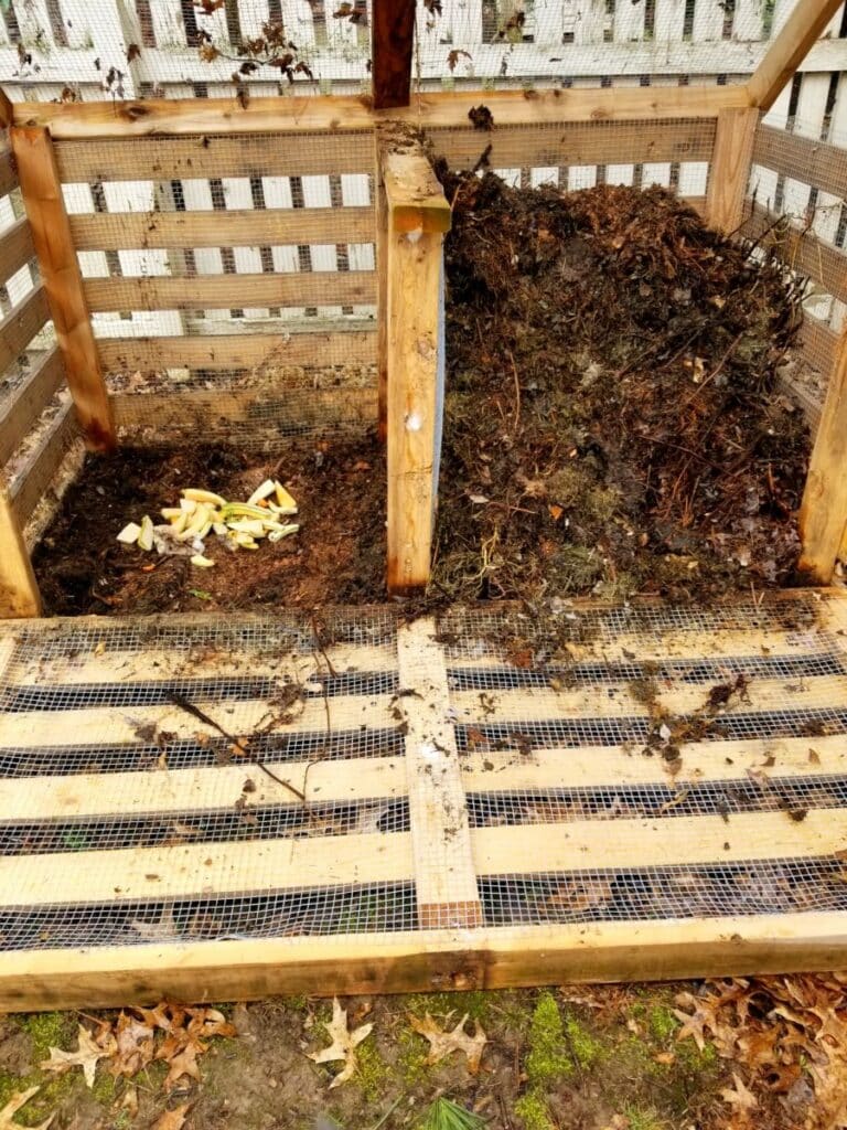 homemade compost bin, made out of wood and chicken wire
