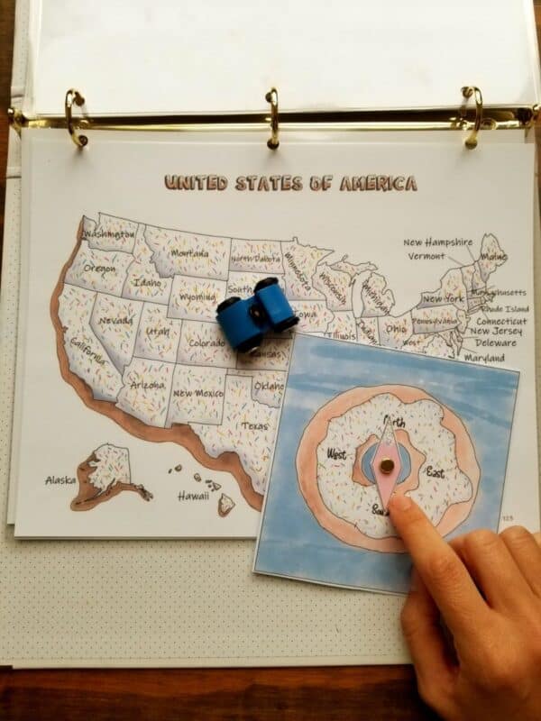 Homeschool printable geography bundle includes continents, oceans, and 50 US states. 50 states compass game is shown.