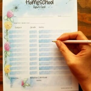 spring flower themed homeschool report card. clovers and dandelions along the side.