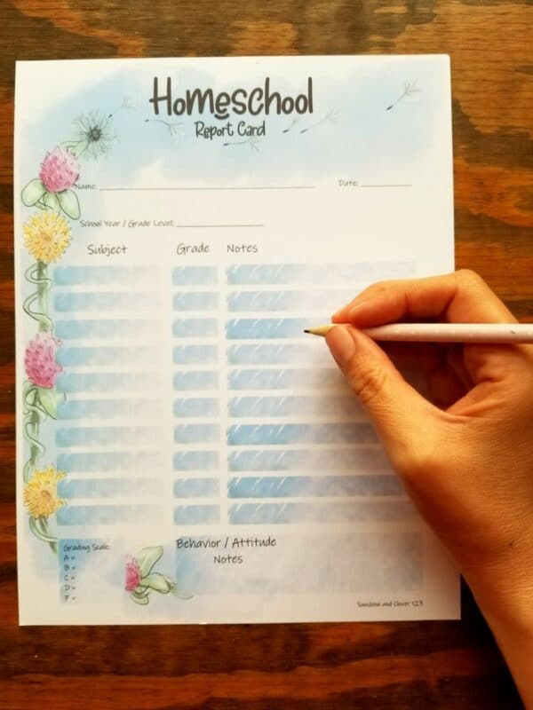 spring flower themed homeschool report card. clovers and dandelions along the side.