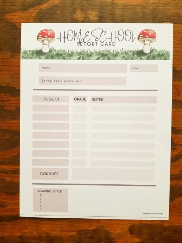 Printable homeschool report card includes hand illustrated mushrooms. Brown accent squares with seven subject lines, grades, and notes. Also includes conduct and grading scale sections.