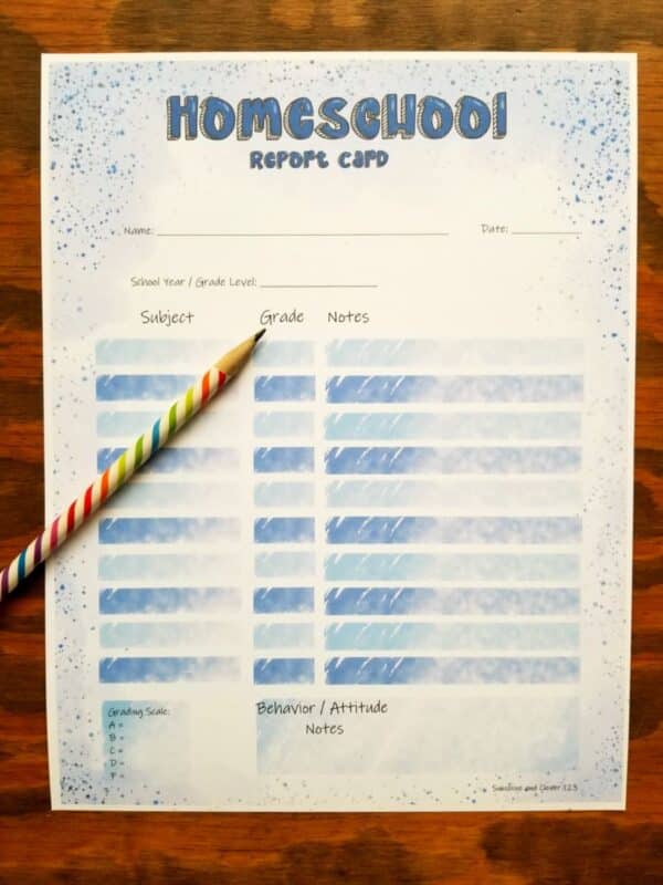 Homeschool report card in blue theme. blue squares to write in grades and subjects as well as blue lettering at the top and blue painting on the edges