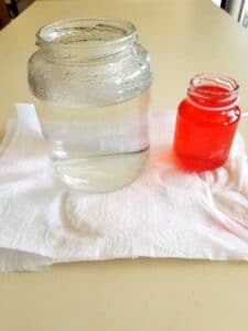 place hot water and dye in small jar