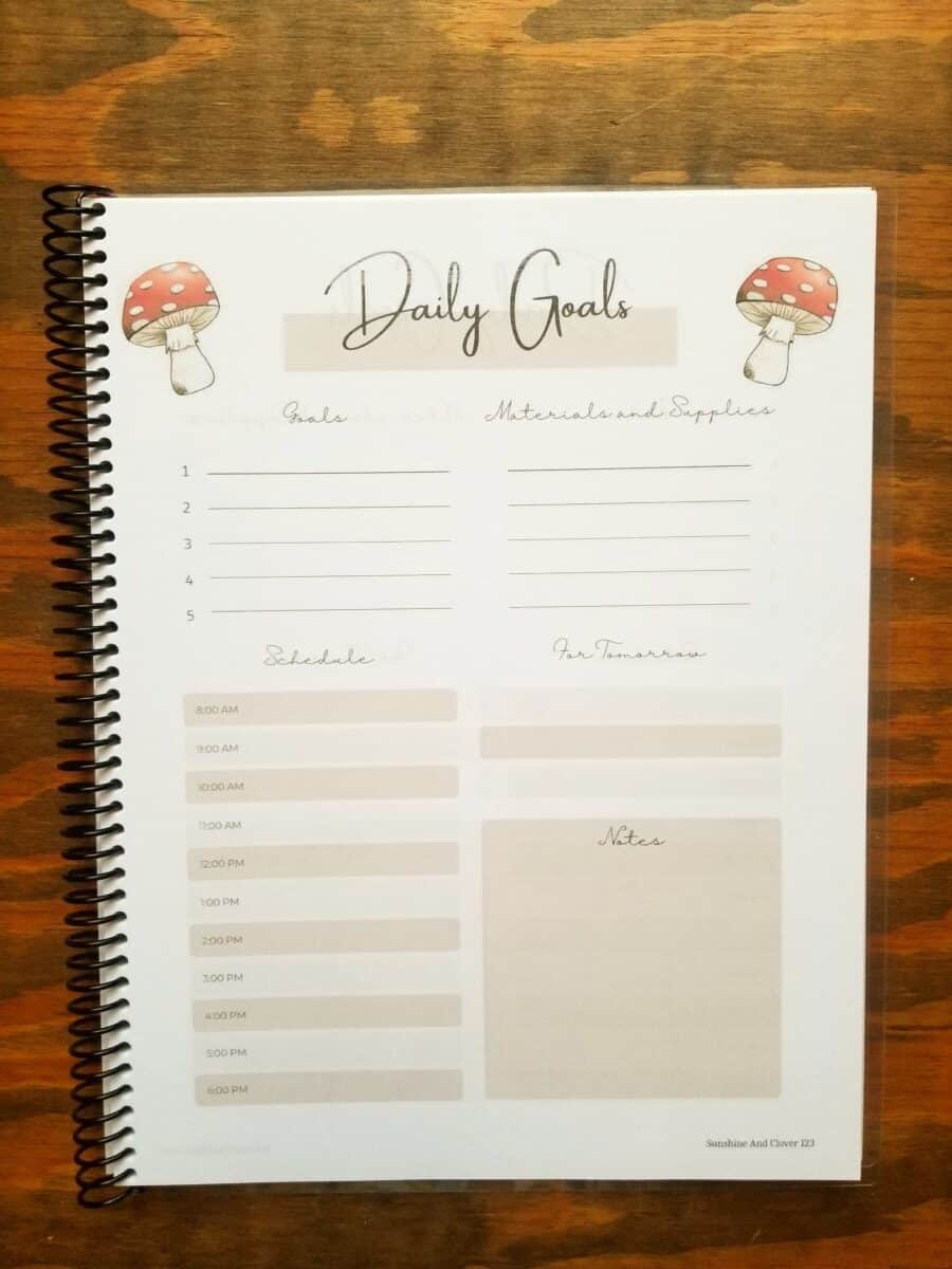 Daily homeschool goals planner with hand illustrated mushroom theme. Homeschool planner includes hourly schedule, notes, materials, for tomorrow and goals for the day sections.