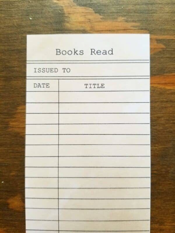 Book log bookmark made to look like an old fashioned library check out card. Titled books read and has issued to section. fill in the date and title of your books as you read them. Has beige vintage coloring.