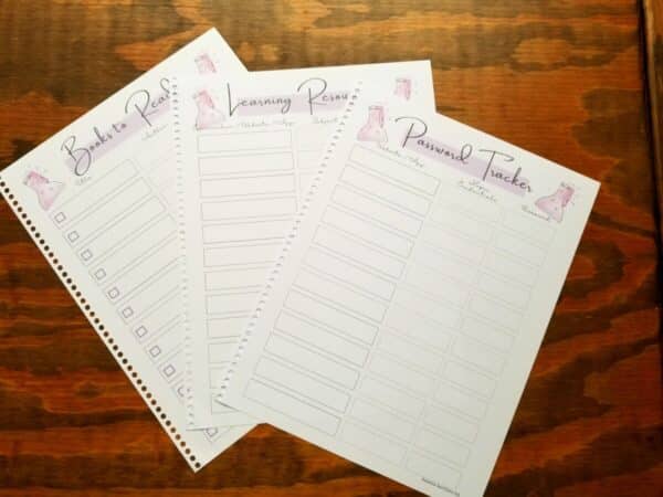 Homeschool planner includes a password tracker, learning resources page, and a book list. All pages have the same hand illustrated science flask with bubbling pink liquid and the same pinkish purple accenting square behind each page title.
