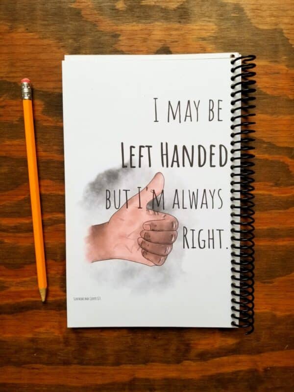 Journal for lefties is made as a funny gift with spiral binding on the opposite side and includes a hand illustrated image of a thumbs up with a funny saying. Font can be customized and you can choose between dark and light skin tones for the hands.