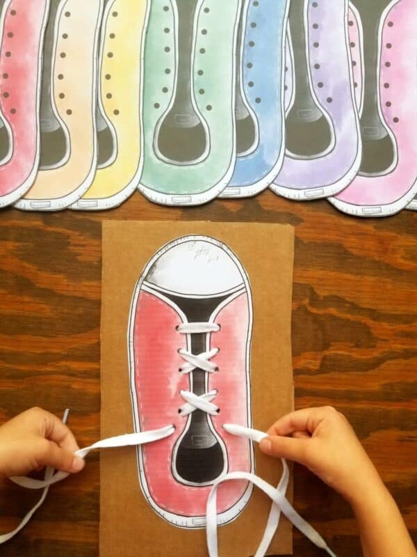 Montessori preschool printables for learning how to tie shoe laces shown cut out and ready to be glued onto cardboard then laced to practice tying shoes.