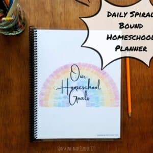Daily homeschool planner to schedule your days on an hourly basis. This spiral bound homeschool planner has hand illustrated rainbow images throughout and has a title on the cover of "Our Homeschool Goals."