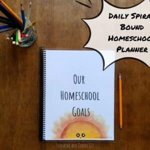 Daily homeschool planner to schedule your days on an hourly basis. This spiral bound homeschool planner has hand illustrated kawaii style drawings throughout and has a little smiling sunshine on the front cover with a title "Our Homeschool Goals."