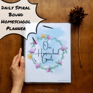 Daily spiral bound homeschool planner contains daily planning pages for hourly planning in your homeschool days. Homeschool planner has a hand illustrated flower ring encircling the title "Our Homeschool Goals."