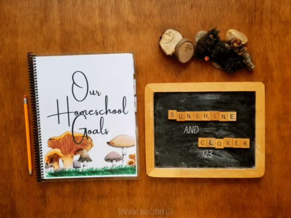 Spiral bound homeschool planner has a mushroom theme throughout the pages as well as the cover and matching mushroom dividers. Cover is titles "Our Homeschool Goals."