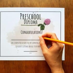 Editable diploma comes in clover design and shown be written on for child's name and date.