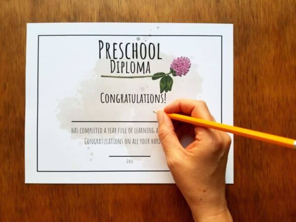 Editable diploma comes in clover design and shown be written on for child's name and date.