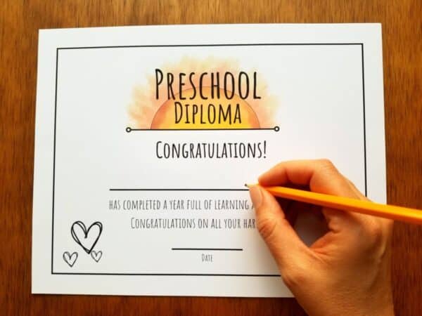 Editable diploma in hand illustrated sunshine theme. Clean white background and room to fill in your child's name and date.