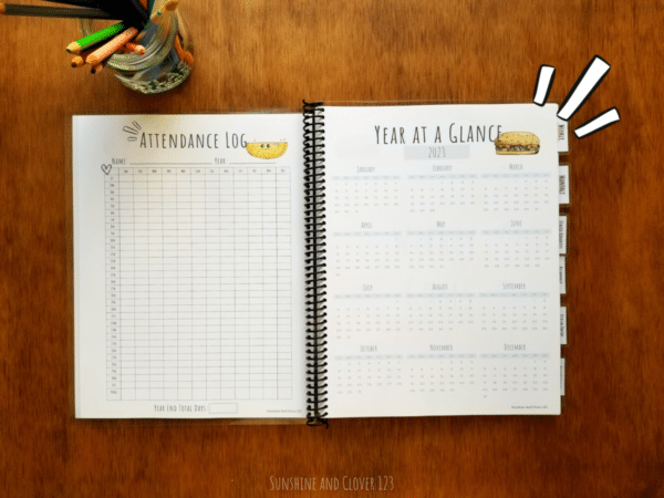 Spiral bound homeschool planner includes an attendance log as well as year at a glance pages. The homeschool planner is spiral bound with a black plastic spiral and has hand illustrated kawaii style images throughout.