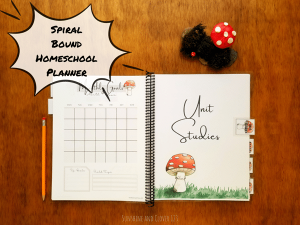 Spiral bound homeschool planner includes unit studies section and monthly calendars that are undated. the whole planner comes in a hand illustrated red mushroom theme.