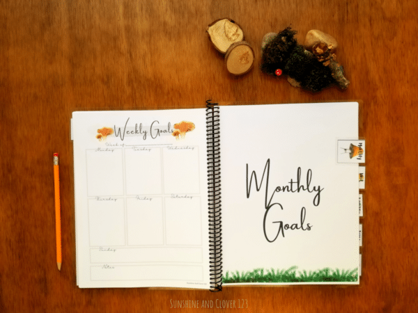 Spiral bound homeschool planner includes weekly planning pages and monthly planning pages divided by matching mushroom dividers.