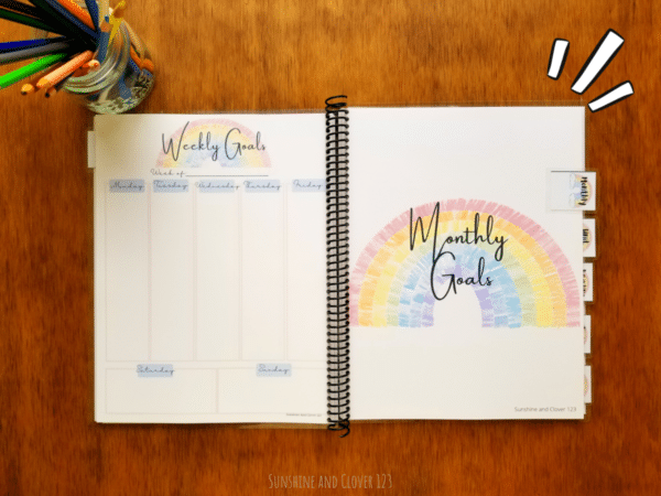 Homeschool planner comes spiral bound and includes weekly planning pages and monthly planning pages to last you an entire year. The planner has a rainbow theme with soft pink and blue accenting throughout.