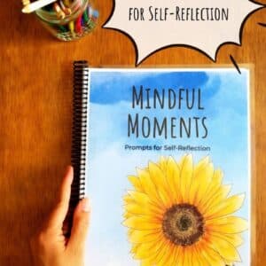 Printable mindfulness journal has a hand illustrated sunflower on the front cover and is titled "Mindful Moments". Prompted journals contains prompts that encourage self reflection.