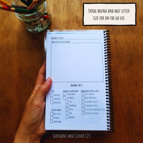 The zoo journal is spiral bound and half letter size for on the go use while exploring at the zoo. Booklet is shown folded in half to display ease of use while doing note taking on the go.