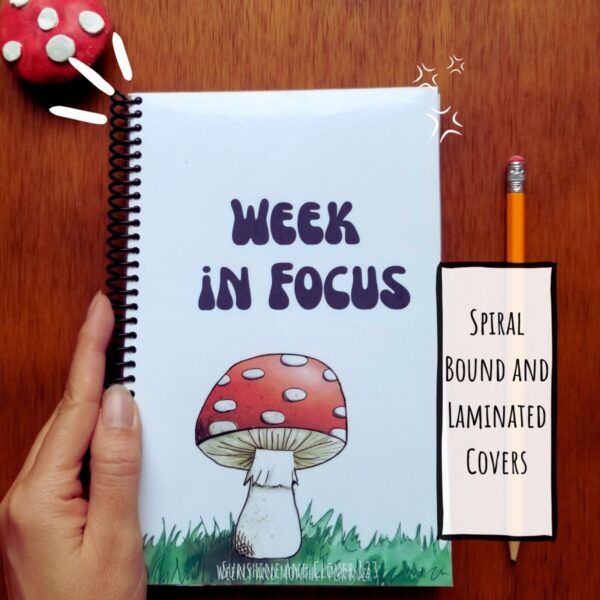 Weekly planner is spiral bound and has laminated covers.